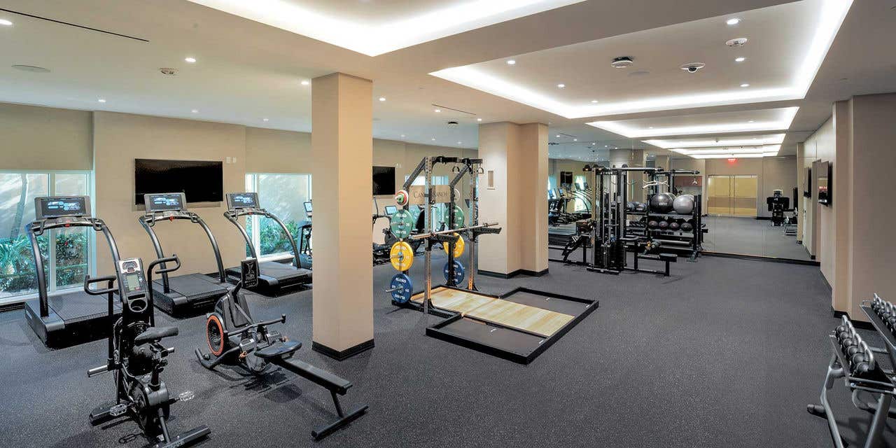 The Venetian South Fitness center featuring treadmills, stationary bikes, weights, and more gym equipment. 