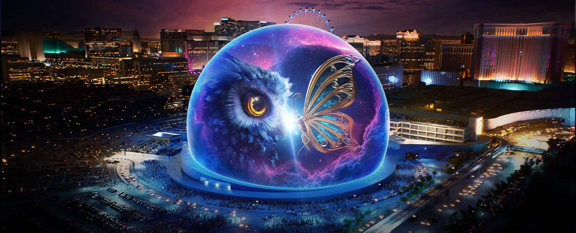 Sphere at The Venetian with illuminated owl and butterfly imagery in cityscape at dusk.